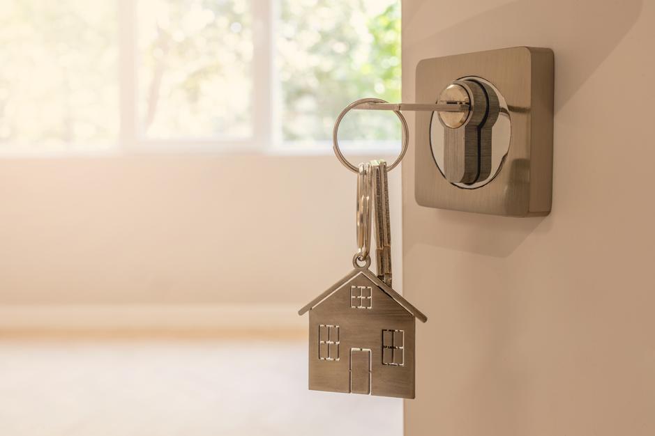 impact-img 334921953-open-door-new-home-key-and-hom